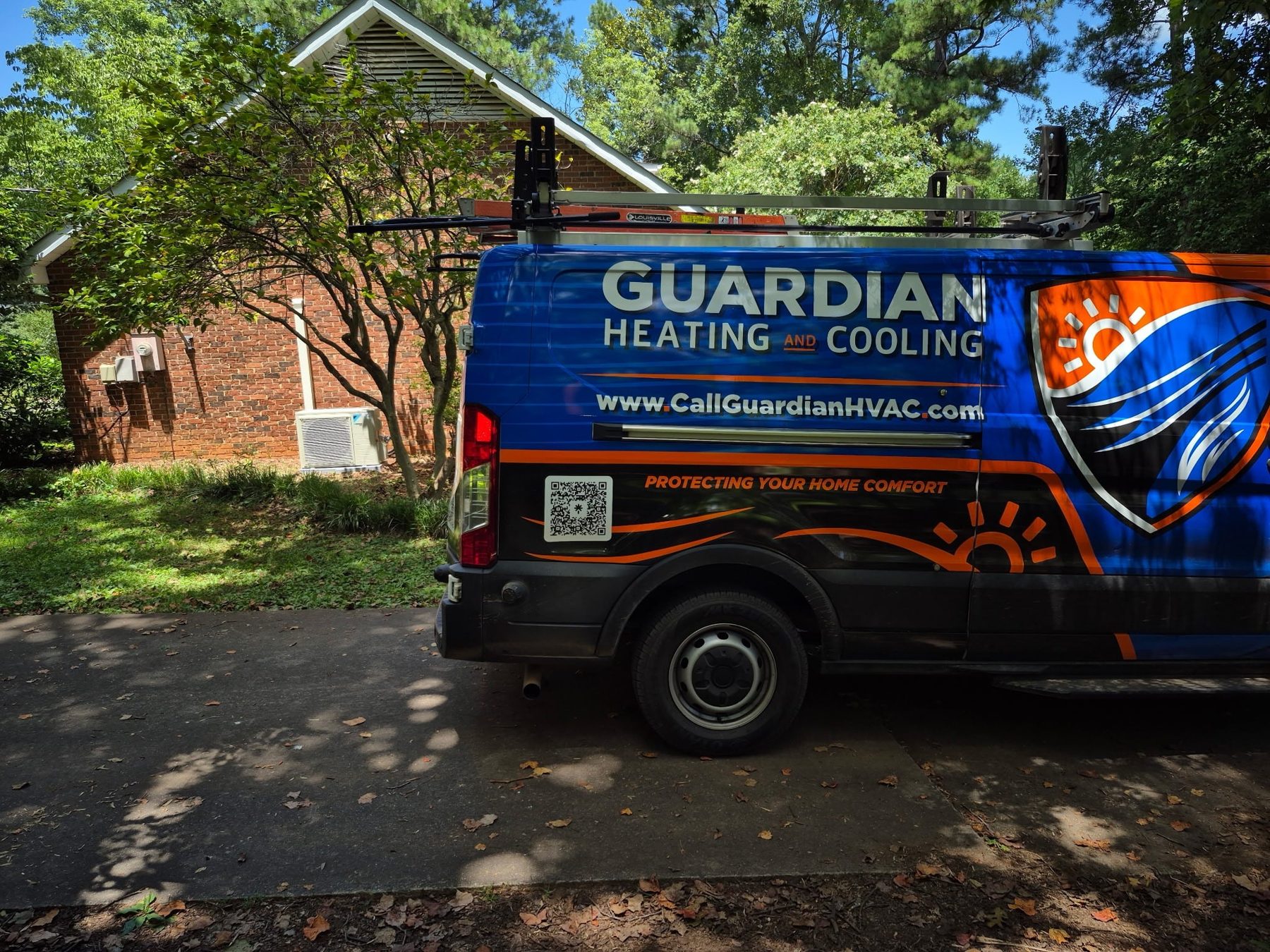 Guardian Heating and Cooling service van parked outside a customer's home