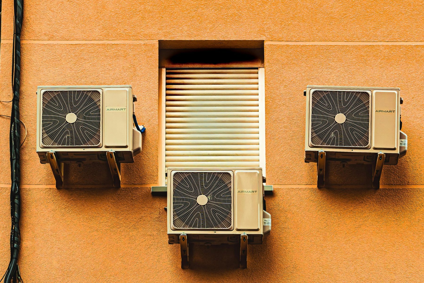 Exterior wall with multiple ventilation and air conditioning units